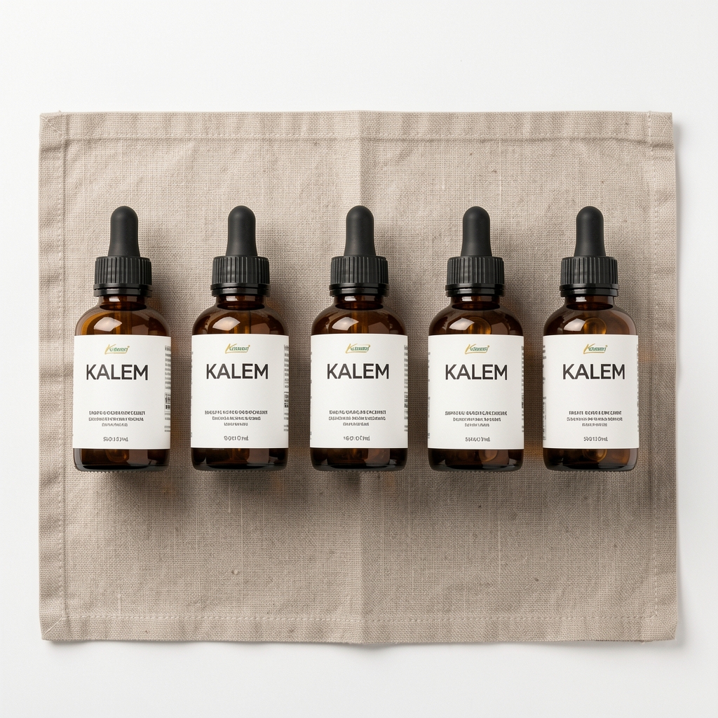 Kalem supplement product line flat lay — six amber bottles arranged in a row on natural linen, clean white background, top-down editorial photography